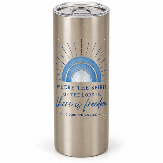 Stainless steel tumbler with a clear lid, blue rainbow arches, gold-colored accents, and Where the Spirit of the Lord Is There Is Freedom lettering.