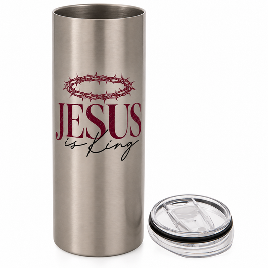 Brushed stainless steel tumbler with a burgundy crown of thorns above JESUS lettering and black is King script, with a clear sliding lid beside it.