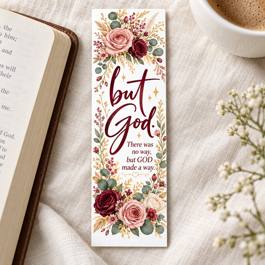 But God floral bookmark with burgundy lettering and blush, cream, and burgundy roses, displayed beside an open book and a cup of coffee.