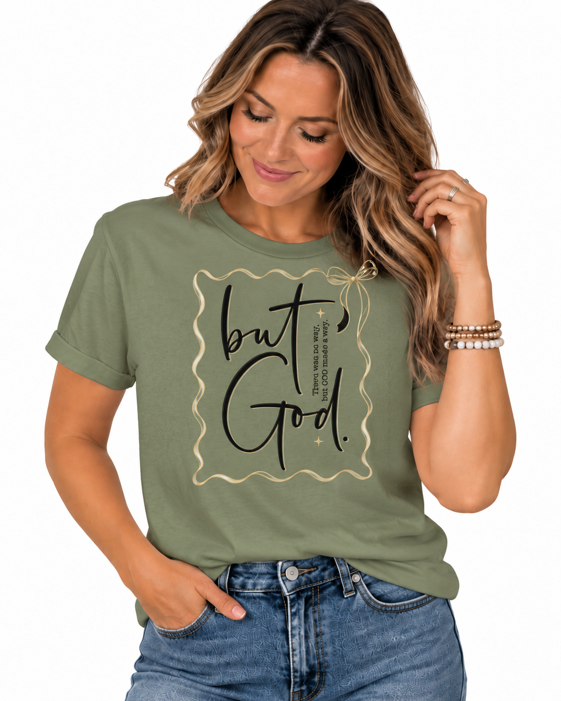 Olive green Christian T-shirt featuring “But God” with “There was no way, but God made a way,” black script, delicate gold frame, bow, and faith-inspired accents.
