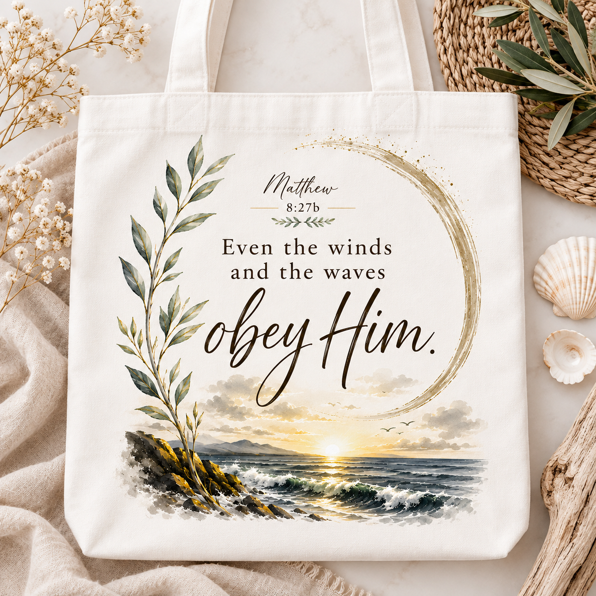 White Christian canvas tote bag featuring a coastal sunrise design and Matthew 8:27 quote, Even the winds and the waves obey Him.