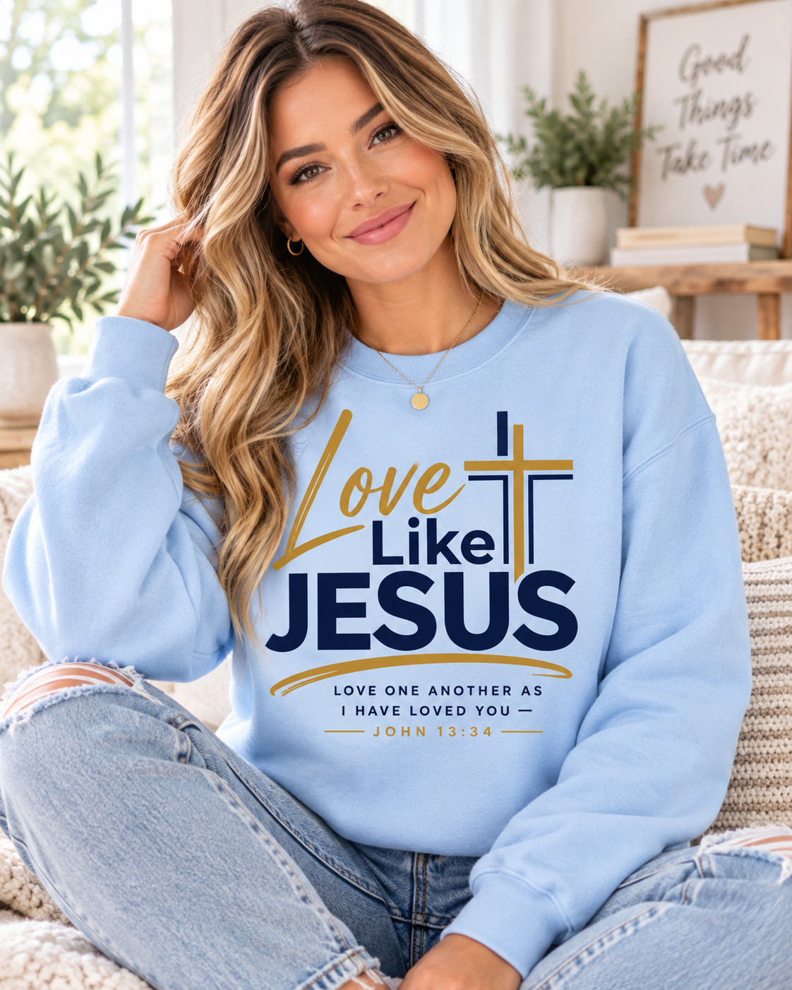 Light blue Love Like Jesus Christian sweatshirt featuring navy and gold lettering, a cross, and John 13:34 from the Journey Wear collection.