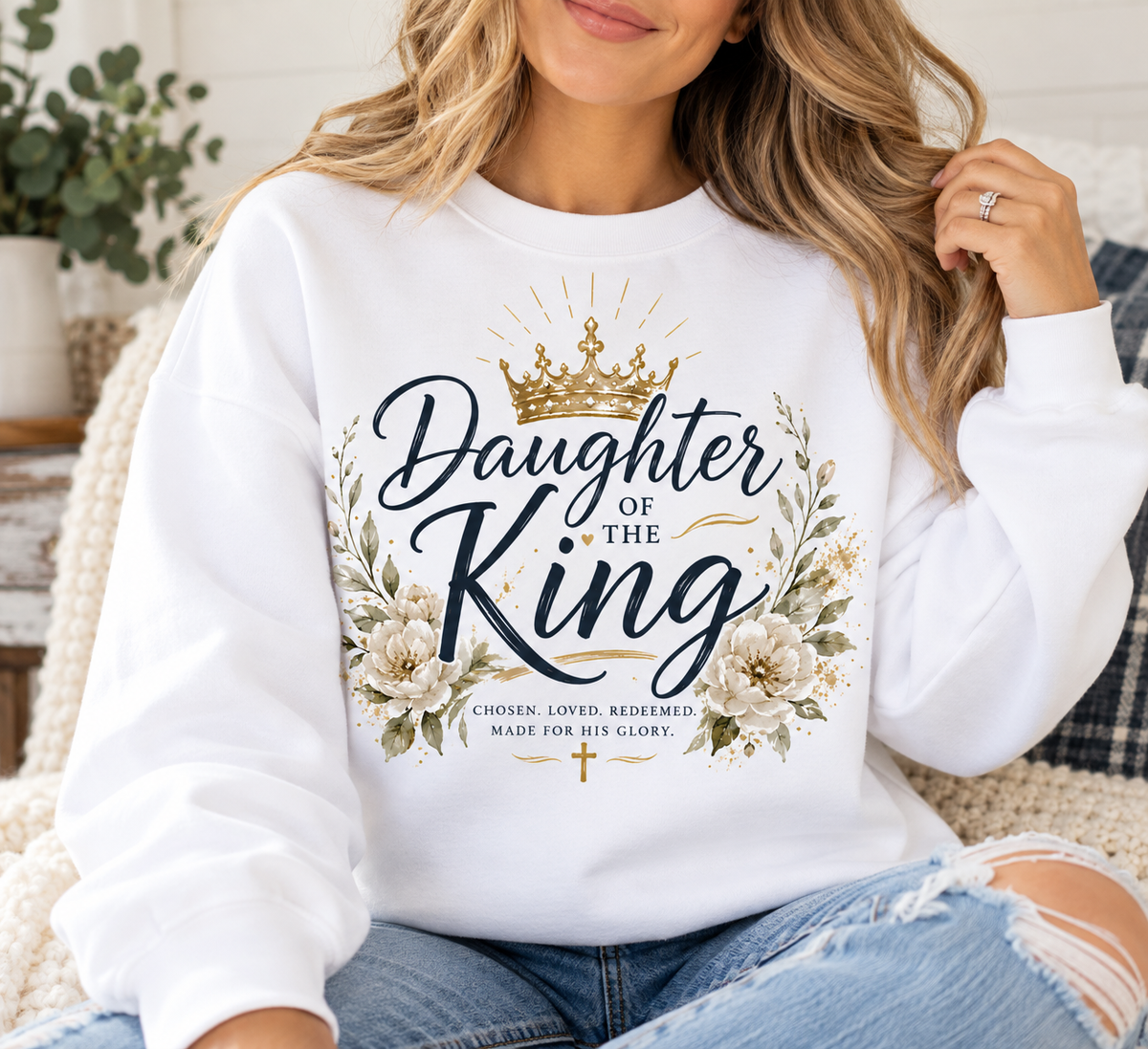 Daughter of the King Christian sweatshirt featuring navy lettering, gold crown, floral accents, and Chosen Loved Redeemed Made for His Glory.