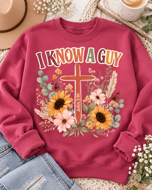 I Know a Guy Christian sweatshirt in dark pink featuring a floral cross and John 3:16 from the Journey Wear collection.