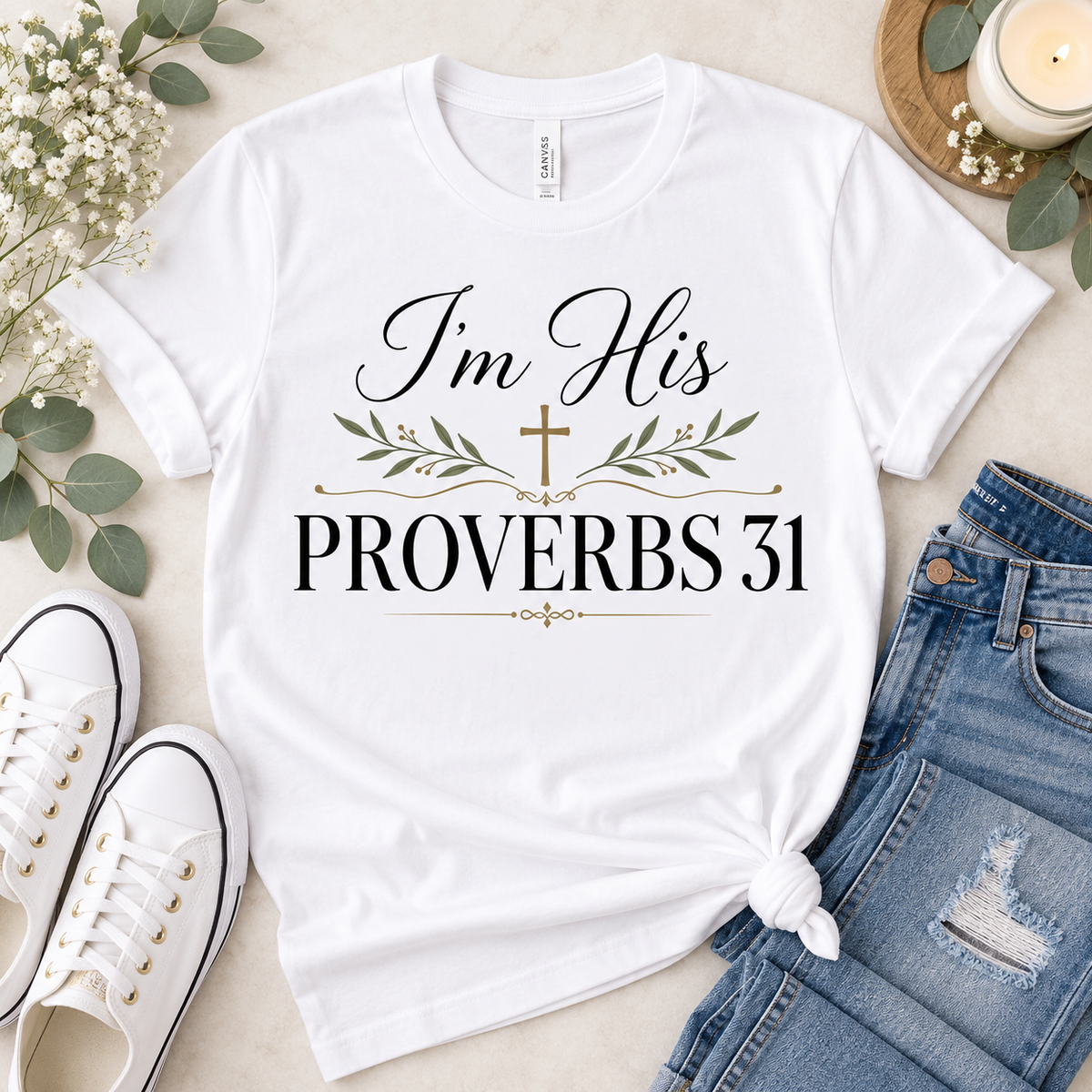 White Christian T-shirt featuring “I’m His — Proverbs 31” with elegant black lettering, a gold cross, and soft botanical accents.
